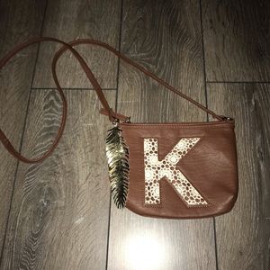 Women’s initial, “K” crossbody bag